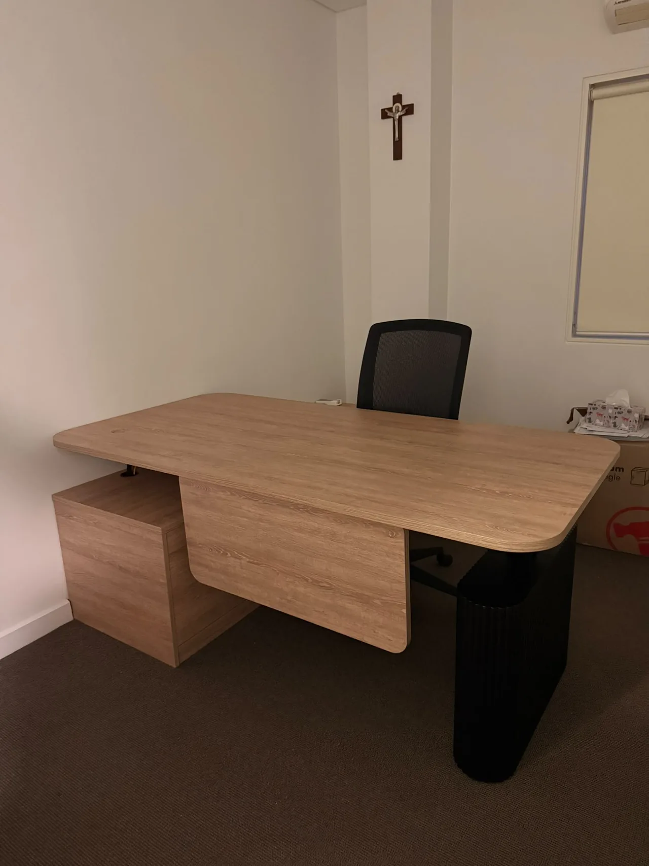 Executive desk with a curved timber top and pedestal