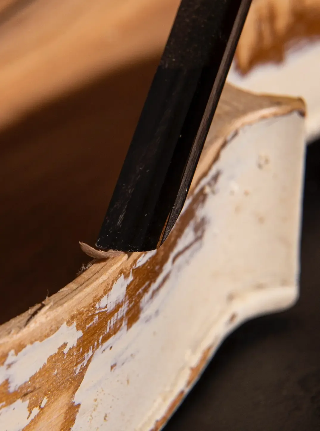 Timber surface being stripped back by hand before French polishing