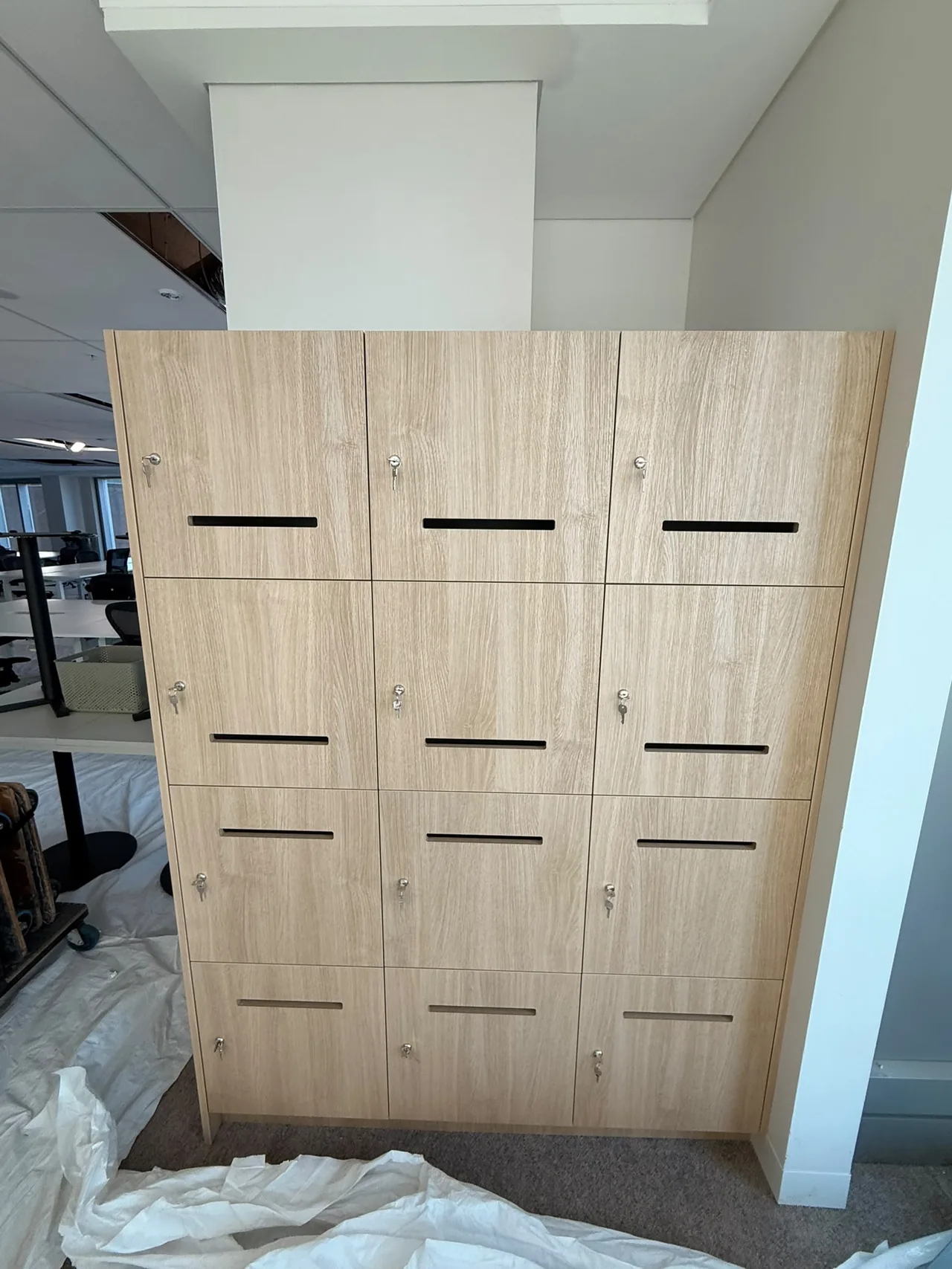 Bank of keyed lockers installed during an office fit-out