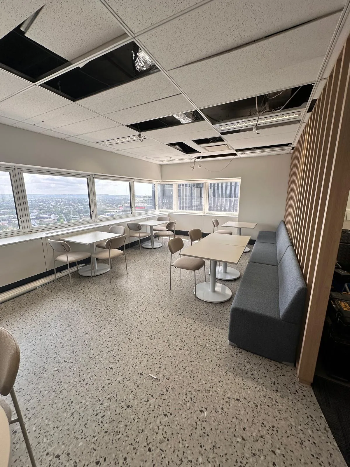 Breakout tables, chairs and banquette delivered and installed in an office