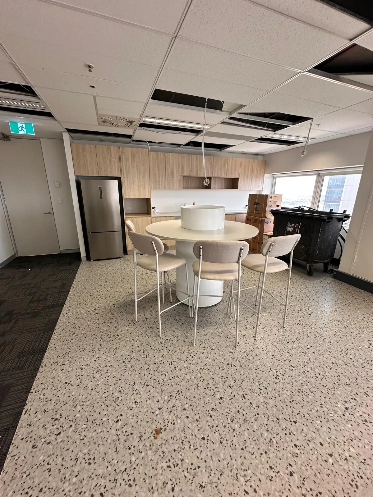 High table and stools installed in an office kitchen