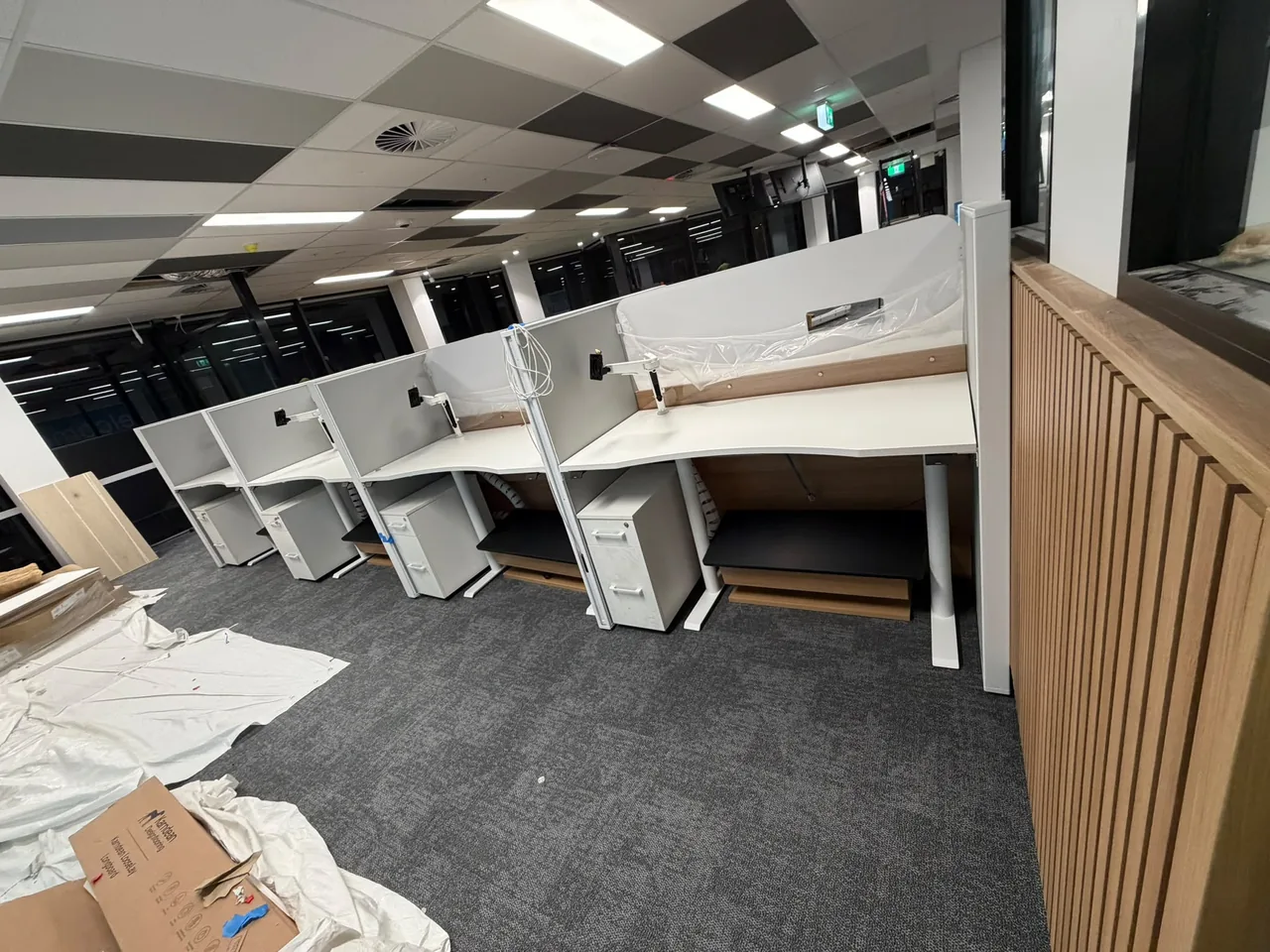 Desks with privacy screens installed in a customer service centre